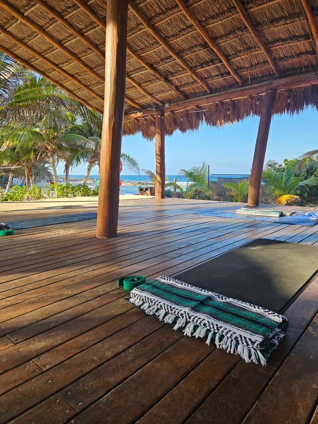yoga studio on the beach with mats